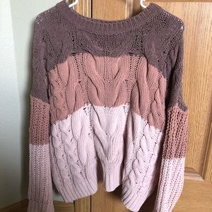 Cute pink sweater.